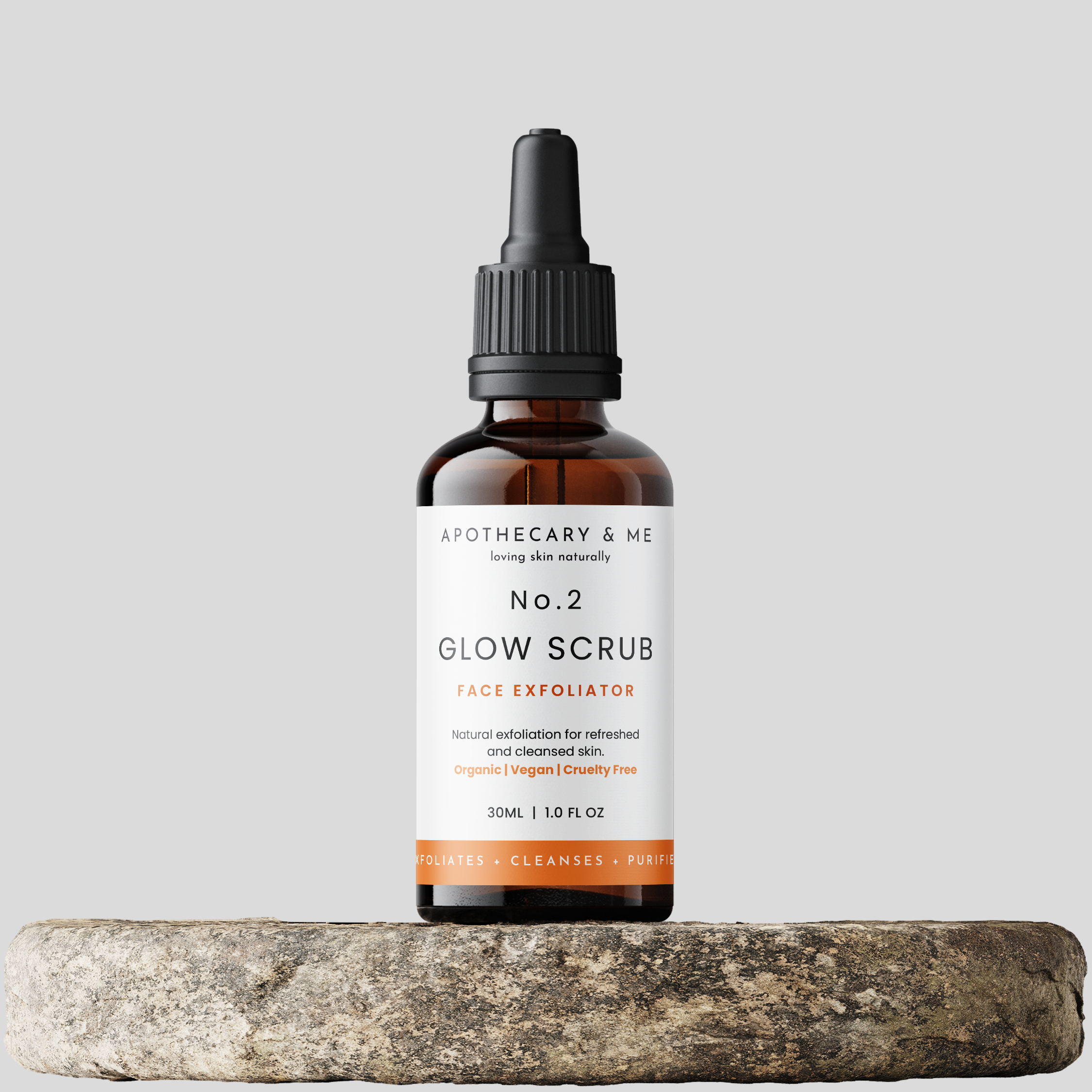 Bottle of Apothecary & Me No. 2 Glow Scrub on a gray background