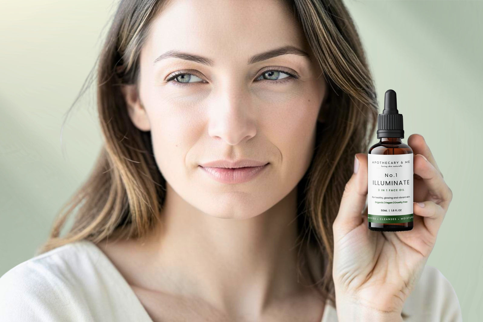 Woman with calm, clear skin holding a bottle of Apothecary & Me No.1 Illuminate Face Oil, a minimal-ingredient fragrance-free face oil as a natural remedy for perioral dermatitis